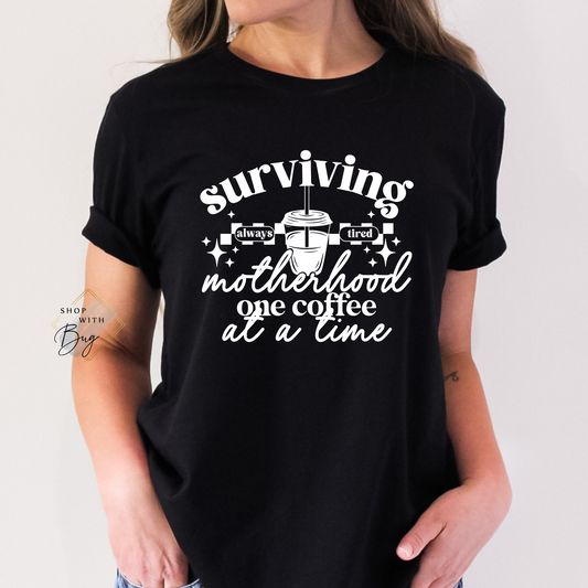 Surviving Motherhood One Coffee at a Time Adult Shirt